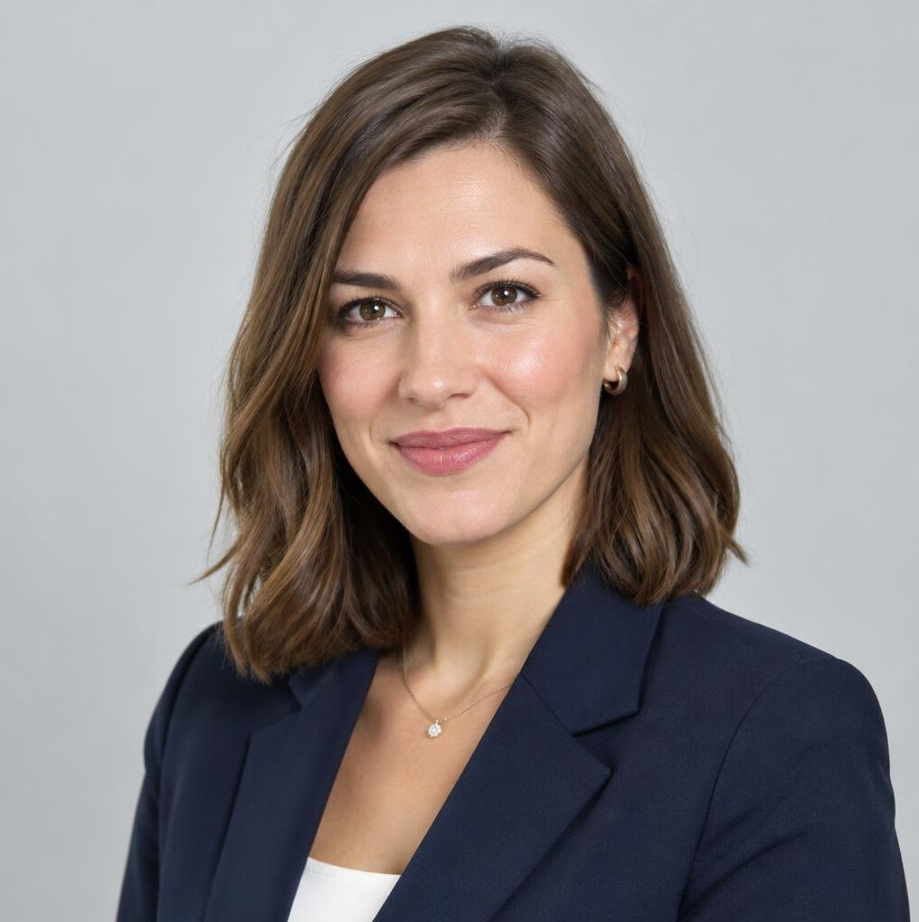 Croatian woman in her 30s with shoulder-length brown hair wearing a blazer, studio portrait
