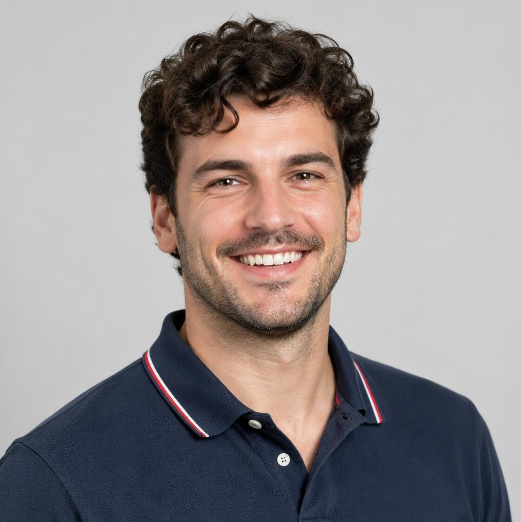 Croatian man in his 30s with dark curly hair wearing a polo shirt, studio portrait